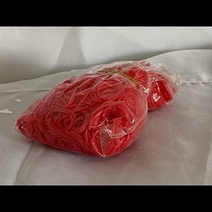 Red, yellow, and pink rubber bands